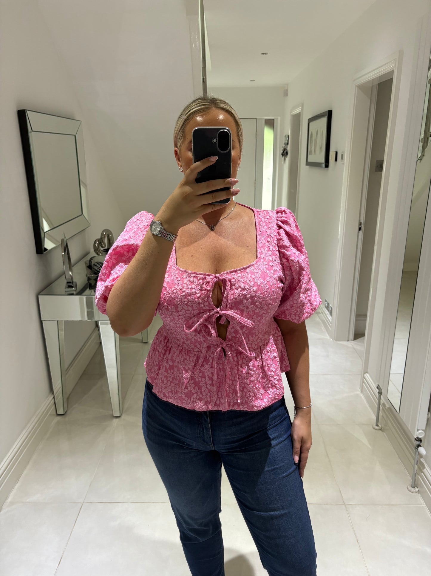CARLY BOW PEPLUM TOP